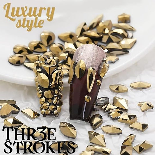 GV432 THR3E STROKES 1300Pcs Mine Gold Nail Rhinestones 60 Multi Shapes Flatback metallic golden Rhinestones Gems +1240 Round Beads K9 Glass Nail Stones Diamonds Nail Art Supplies for Nails Faces Eyes Makeup Crafts (D5)